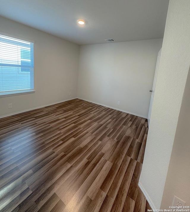 15302 Smoky Honeyeater, San Antonio, TX 78253 - unfurnished room with dark wood-type flooring, baseboards, and recessed lighting