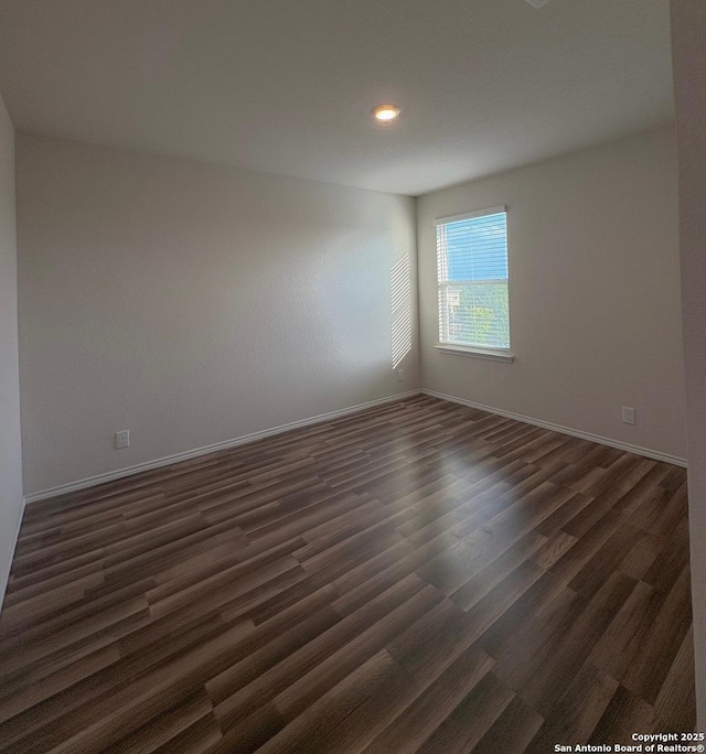 15302 Smoky Honeyeater, San Antonio, TX 78253 - empty room with dark wood-style flooring, baseboards, and recessed lighting