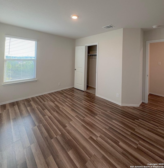 15302 Smoky Honeyeater, San Antonio, TX 78253 - unfurnished bedroom with wood finished floors, baseboards, recessed lighting, and a closet