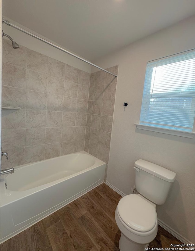 15302 Smoky Honeyeater, San Antonio, TX 78253 - bathroom with toilet, wood finished floors, shower / bathtub combination, and baseboards