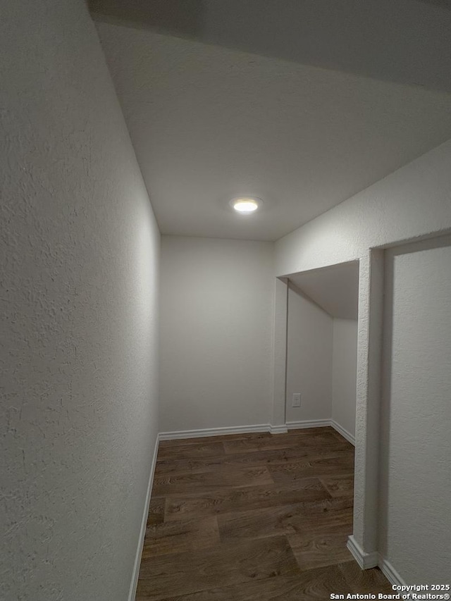15302 Smoky Honeyeater, San Antonio, TX 78253 - unfurnished room with wood finished floors, a textured wall, and baseboards