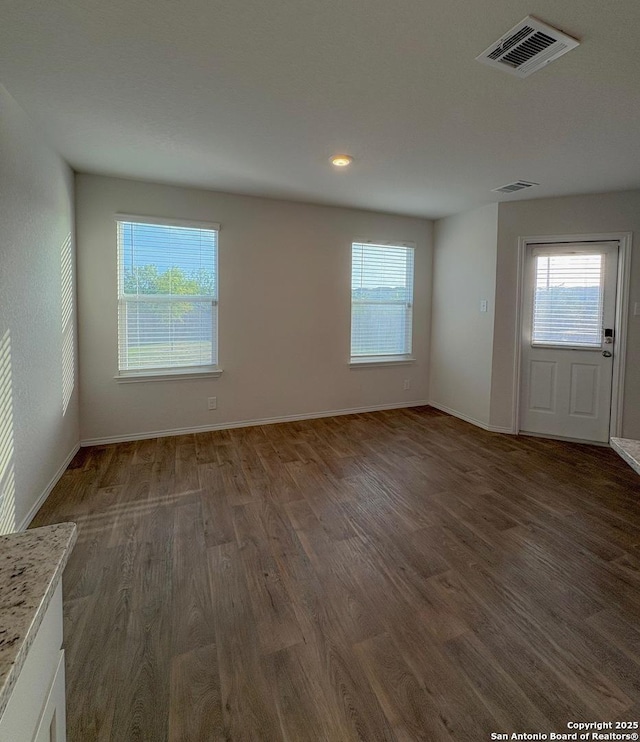 15302 Smoky Honeyeater, San Antonio, TX 78253 - empty room with wood finished floors, healthy amount of natural light, and baseboards