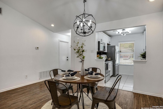 12102 Stoney Cir, San Antonio, TX 78247 - dining space featuring a chandelier, baseboards, light wood-style flooring, and recessed lighting
