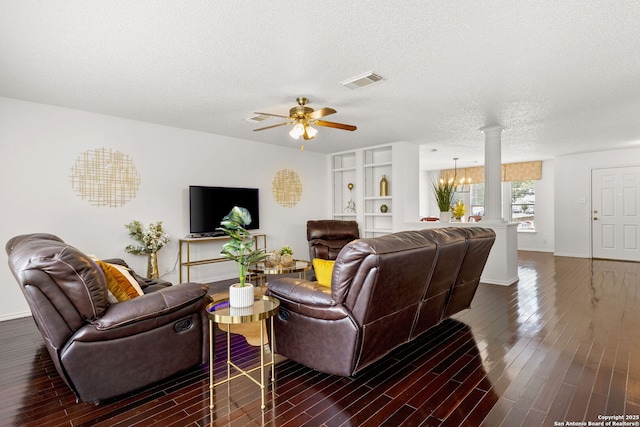 1339 Pecan Sta, San Antonio, TX 78258 - living room with ornate columns, dark wood-style flooring, a ceiling fan, baseboards, and a textured ceiling