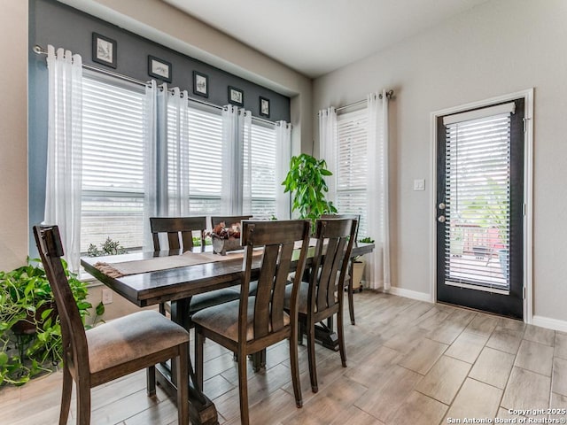 5344 Jasmine, Bulverde, TX 78163 - dining space with light wood-style flooring and baseboards