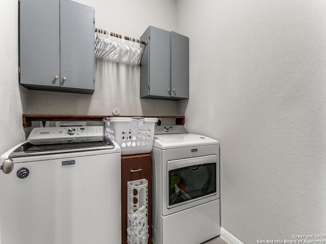 5344 Jasmine, Bulverde, TX 78163 - laundry area with cabinet space, washing machine and clothes dryer, and baseboards