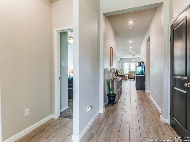 5344 Jasmine, Bulverde, TX 78163 - hall featuring light wood-type flooring, baseboards, and recessed lighting