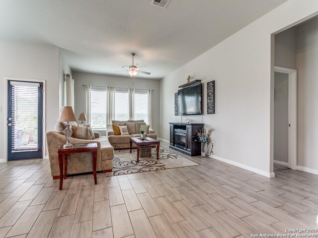 5344 Jasmine, Bulverde, TX 78163 - living area with light wood-type flooring, baseboards, and a ceiling fan