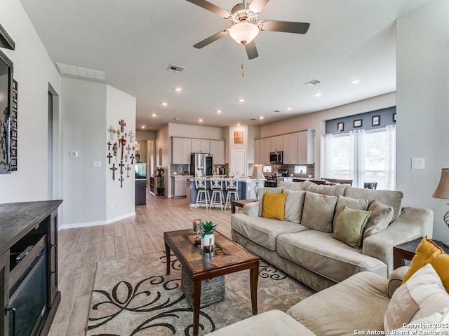 5344 Jasmine, Bulverde, TX 78163 - living room featuring light wood-type flooring, ceiling fan, baseboards, and recessed lighting