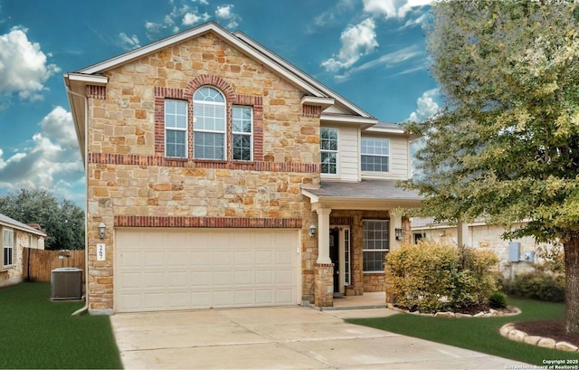 267 Oak Crk, New Braunfels, TX 78130 - view of front of property featuring stone siding, a garage, concrete driveway, and central AC unit