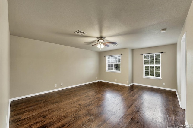 267 Oak Crk, New Braunfels, TX 78130 - empty room with ceiling fan, dark wood-style flooring, baseboards, and a textured ceiling
