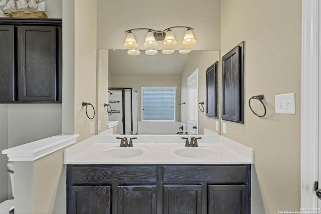 267 Oak Crk, New Braunfels, TX 78130 - full bath featuring a stall shower, double vanity, and toilet
