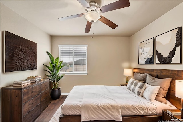 267 Oak Crk, New Braunfels, TX 78130 - bedroom featuring dark wood-style floors, baseboards, and a ceiling fan