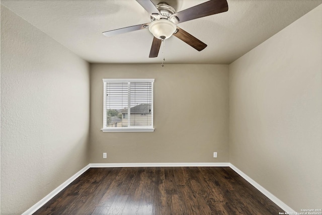 267 Oak Crk, New Braunfels, TX 78130 - unfurnished room featuring dark wood-style floors, baseboards, and a ceiling fan