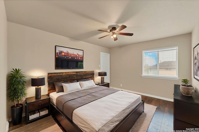 267 Oak Crk, New Braunfels, TX 78130 - bedroom with hardwood / wood-style flooring, baseboards, and a ceiling fan
