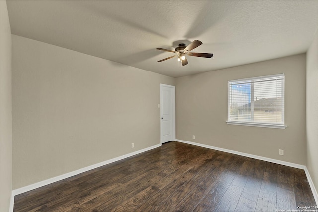 267 Oak Crk, New Braunfels, TX 78130 - unfurnished room with a ceiling fan, baseboards, and dark wood-type flooring