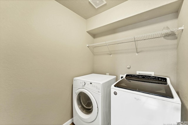 267 Oak Crk, New Braunfels, TX 78130 - washroom featuring washer and clothes dryer and baseboards