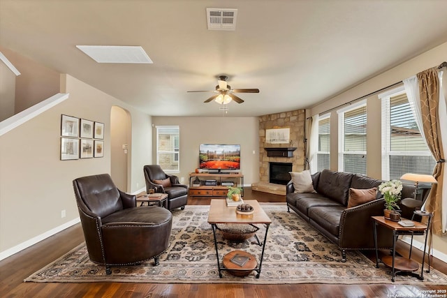 267 Oak Crk, New Braunfels, TX 78130 - living area with arched walkways, ceiling fan, wood finished floors, and healthy amount of natural light
