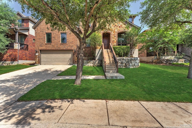 25702 Willard Path, San Antonio, TX 78261 - view of front of property featuring a garage, driveway, stairway, brick siding, and a front lawn