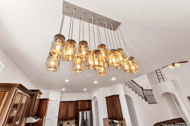 25702 Willard Path, San Antonio, TX 78261 - detailed view of freestanding refrigerator, arched walkways, and recessed lighting