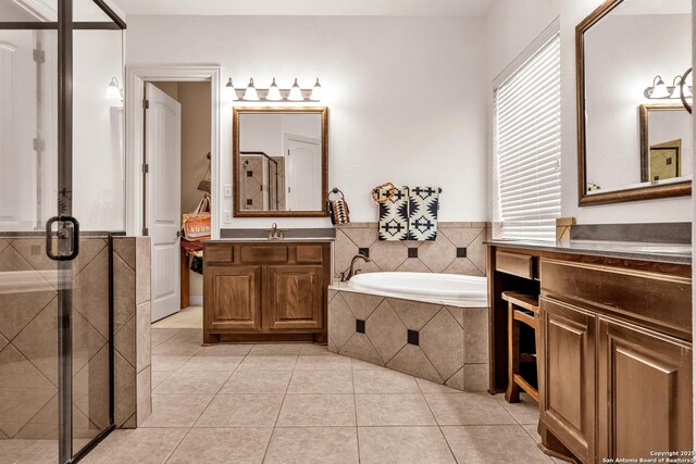 25702 Willard Path, San Antonio, TX 78261 - bathroom featuring a shower stall, a bath, two vanities, and tile patterned floors