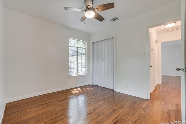 135 Englewood, San Antonio, TX 78213 - unfurnished bedroom featuring wood finished floors, baseboards, and a closet
