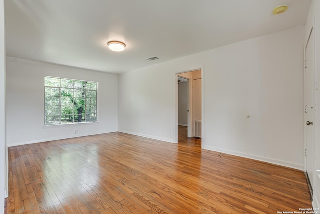 135 Englewood, San Antonio, TX 78213 - unfurnished room with light wood-style floors, baseboards, and a smoke detector