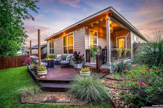 891 Noel, New Braunfels, TX 78130 - back of house at dusk with a wooden deck