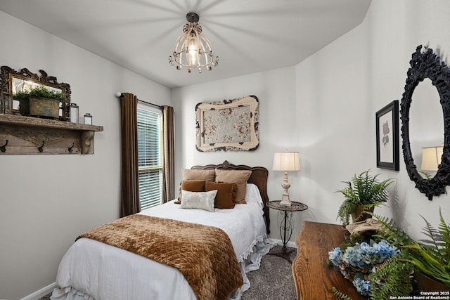 891 Noel, New Braunfels, TX 78130 - bedroom with baseboards, a chandelier, and carpet flooring