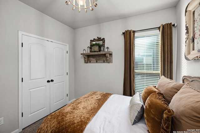 891 Noel, New Braunfels, TX 78130 - bedroom with carpet floors, a closet, and a chandelier