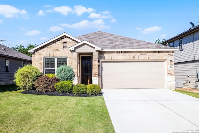 891 Noel, New Braunfels, TX 78130 - single story home featuring brick siding, concrete driveway, a front yard, a garage, and roof with shingles