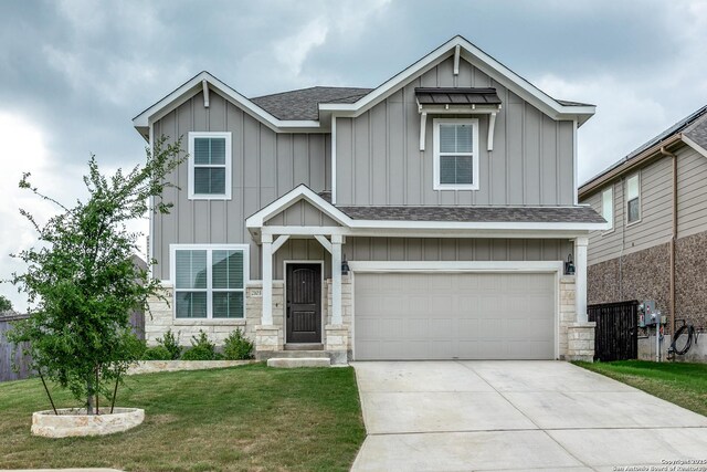 2103 Dalhart, San Antonio, TX 78253 - view of front of home featuring board and batten siding, roof with shingles, concrete driveway, a front yard, and an attached garage