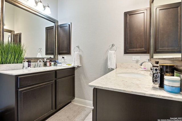 6239 Carriage Cpe, San Antonio, TX 78261 - bathroom featuring vanity and baseboards