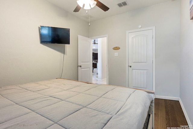6239 Carriage Cpe, San Antonio, TX 78261 - bedroom with wood finished floors, baseboards, vaulted ceiling, and a ceiling fan