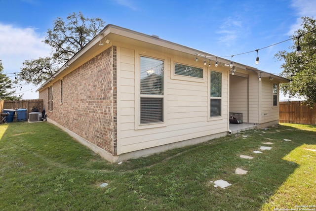 6239 Carriage Cpe, San Antonio, TX 78261 - view of home's exterior featuring brick siding and central AC