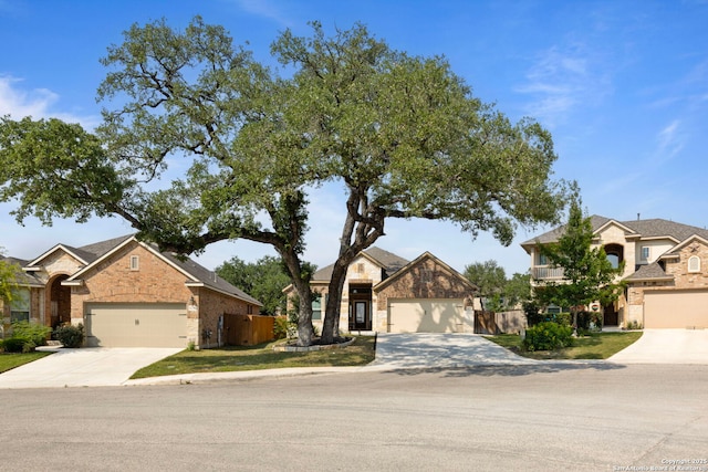 6239 Carriage Cpe, San Antonio, TX 78261 - traditional-style home with concrete driveway, stone siding, brick siding, and an attached garage