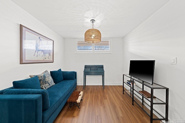1006 Guadalupe St Unit 1B, Kerrville, TX 78028 - living area with wood finished floors and baseboards