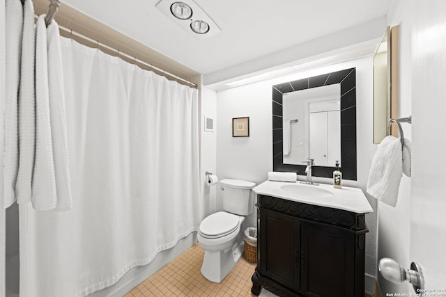 1006 Guadalupe St Unit 1B, Kerrville, TX 78028 - bathroom with vanity, toilet, and tile patterned flooring