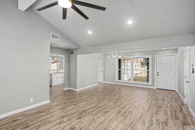 2723 Woodline, San Antonio, TX 78251 - unfurnished living room featuring a chandelier, a sink, light wood-style flooring, high vaulted ceiling, and ceiling fan