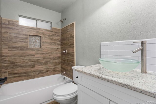 2723 Woodline, San Antonio, TX 78251 - bathroom with vanity, toilet,  shower combination, and a textured wall