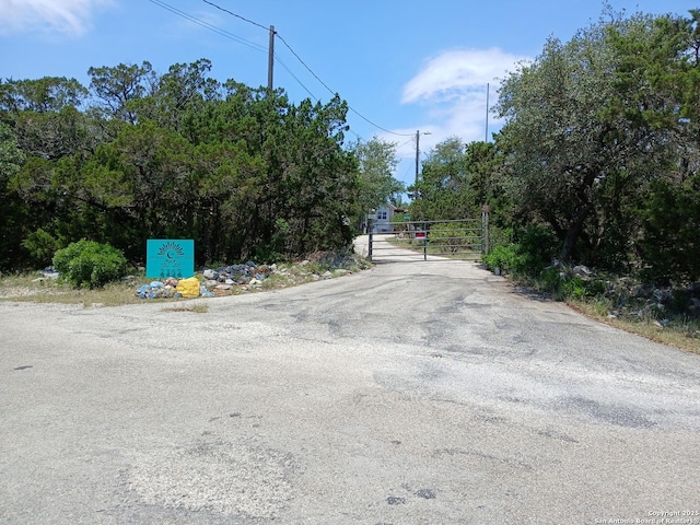 2362 Timbercreek, Pipe Creek, TX 78063 - view of street featuring a gate