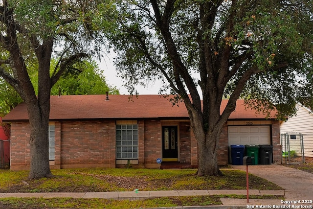 3310 Showboat, San Antonio, TX 78223 - ranch-style house featuring driveway, a garage, and brick siding