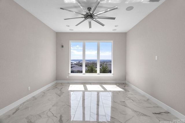142 Wizard, Spring Branch, TX 78070 - unfurnished room featuring light marble finish floors, baseboards, and ceiling fan