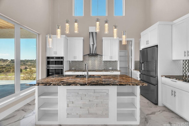142 Wizard, Spring Branch, TX 78070 - kitchen featuring fridge with ice dispenser, light marble finish floors, wall chimney range hood, a towering ceiling, and a sink