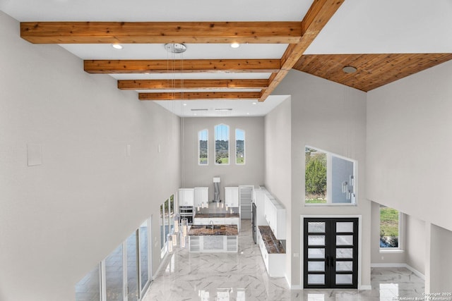 142 Wizard, Spring Branch, TX 78070 - foyer featuring light marble finish floors, recessed lighting, plenty of natural light, beam ceiling, and french doors