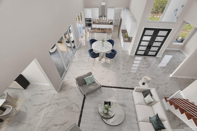 142 Wizard, Spring Branch, TX 78070 - foyer featuring marble tiled floors, a high ceiling, baseboards, and french doors