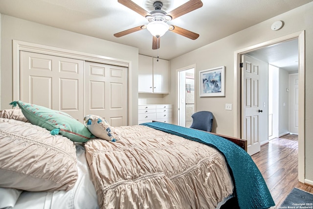 3811 E Songbird Ln, San Antonio, TX 78229 - bedroom with wood finished floors, a closet, a ceiling fan, and baseboards