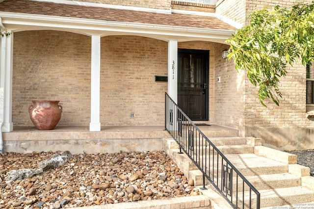 3811 E Songbird Ln, San Antonio, TX 78229 - property entrance with brick siding and a shingled roof
