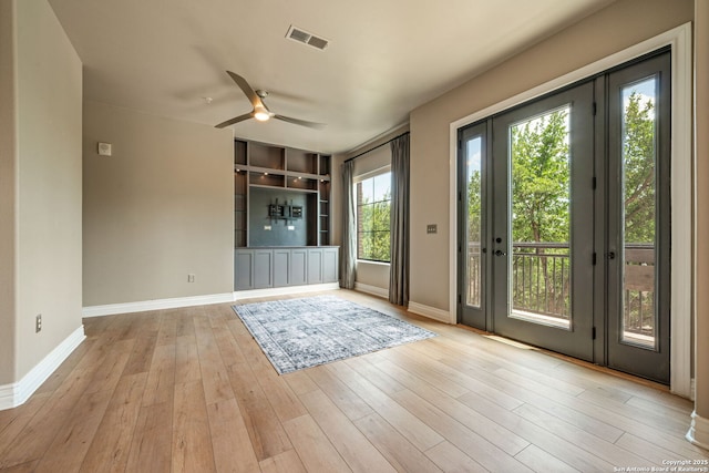 215 Center Apt 3, San Antonio, TX 78202 - entryway with ceiling fan, baseboards, wood finished floors, and built in shelves