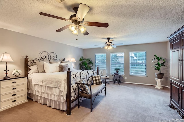 2334 Creekside Bnd, San Antonio, TX 78259 - bedroom featuring light carpet, a textured ceiling, a ceiling fan, and baseboards